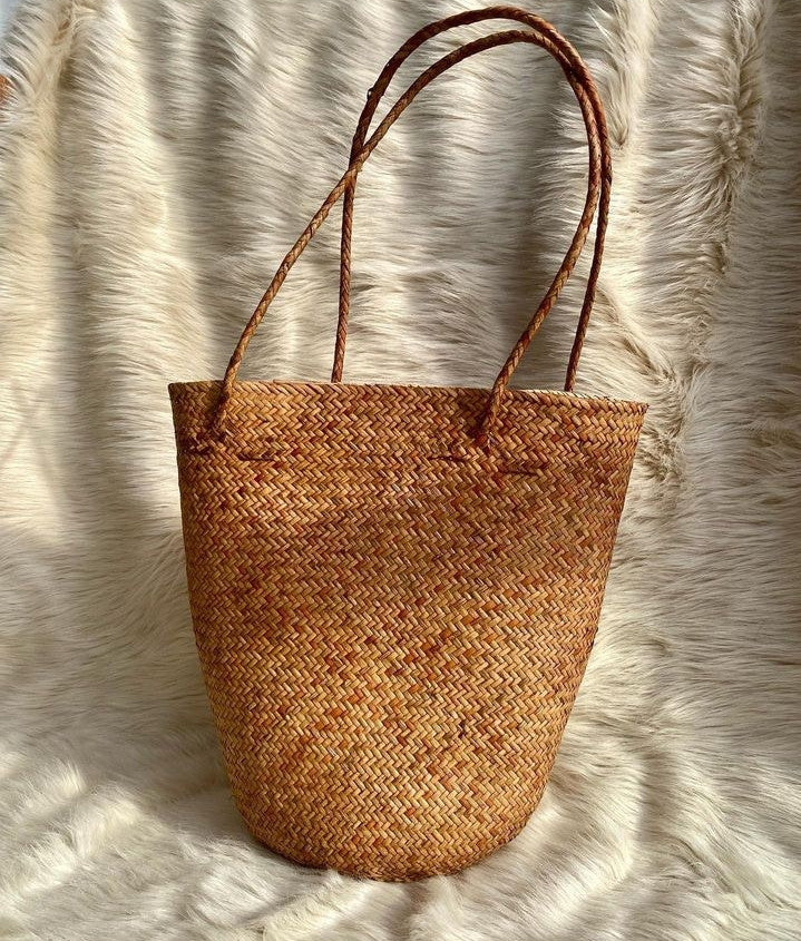 A rattan bag is the perfect accessory for a day at the beach, as it adds a touch of bohemian style to your outfit while also providing a functional place to store your essentials.