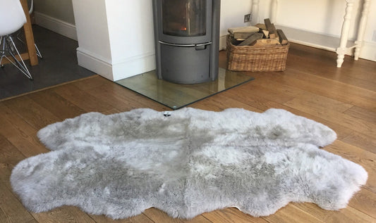 Luxurious and soft, this grey sheepskin rug adds a touch of elegance to any room. Its natural color complements a variety of decor styles while providing warmth and comfort underfoot