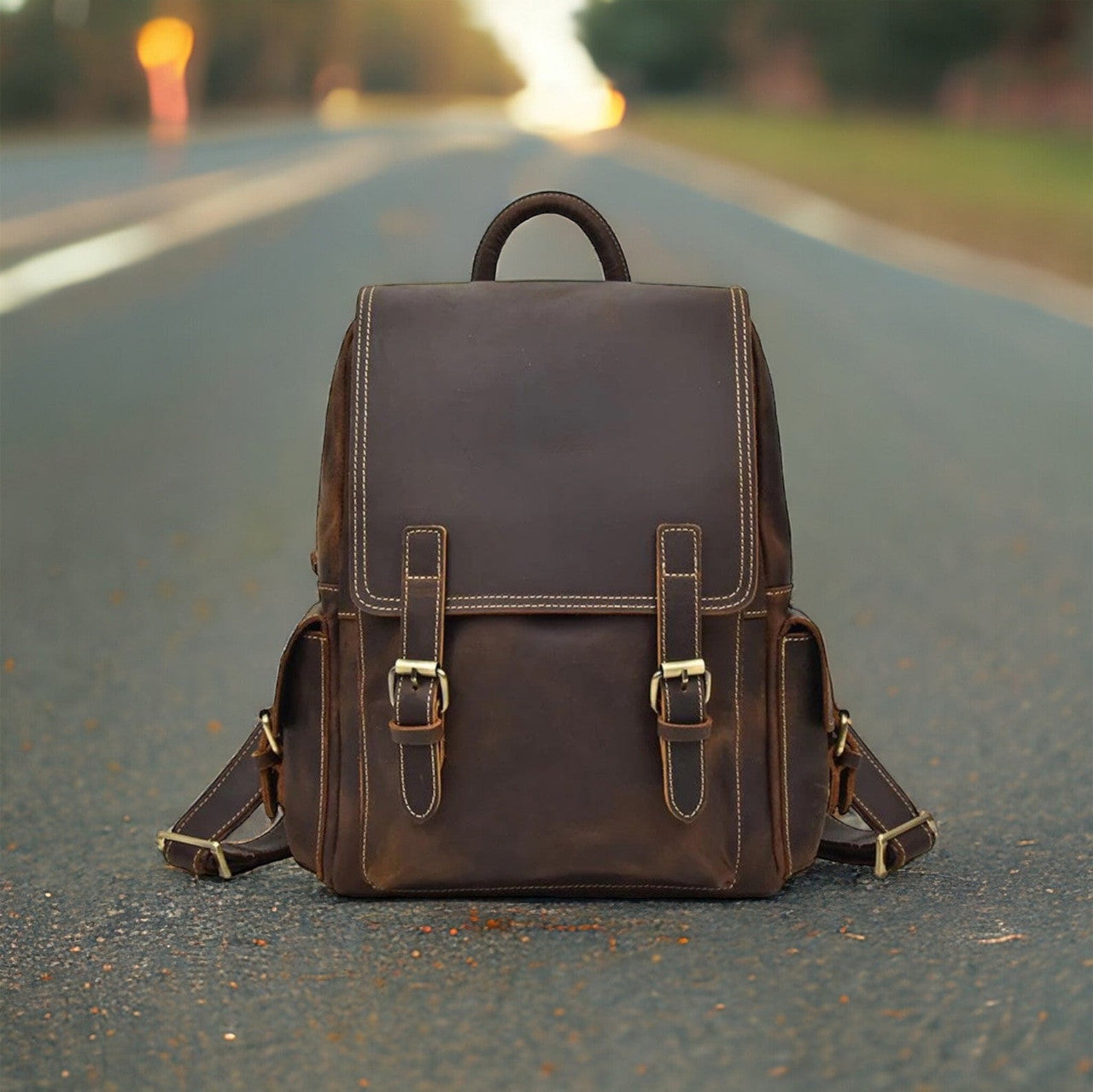 A close-up view of a sleek leather backpack, showcasing its smooth, supple texture and intricate stitching details. The rich, caramel-brown color of the leather exudes warmth and sophistication, while the polished metal hardware adds a touch of elegance. The backpack features adjustable straps and multiple compartments, suggesting functionality and practicality for everyday use.