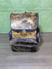 Treat yourself to a stylish, yet practical solution for your everyday needs with this one-of-a-kind custom made Brindle brown cowhide backpack.