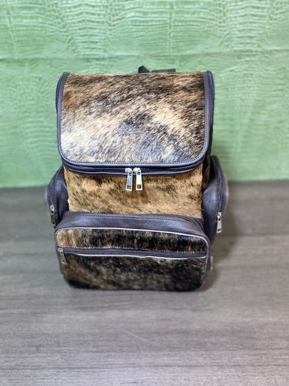 Treat yourself to a stylish, yet practical solution for your everyday needs with this one-of-a-kind custom made Brindle brown cowhide backpack.