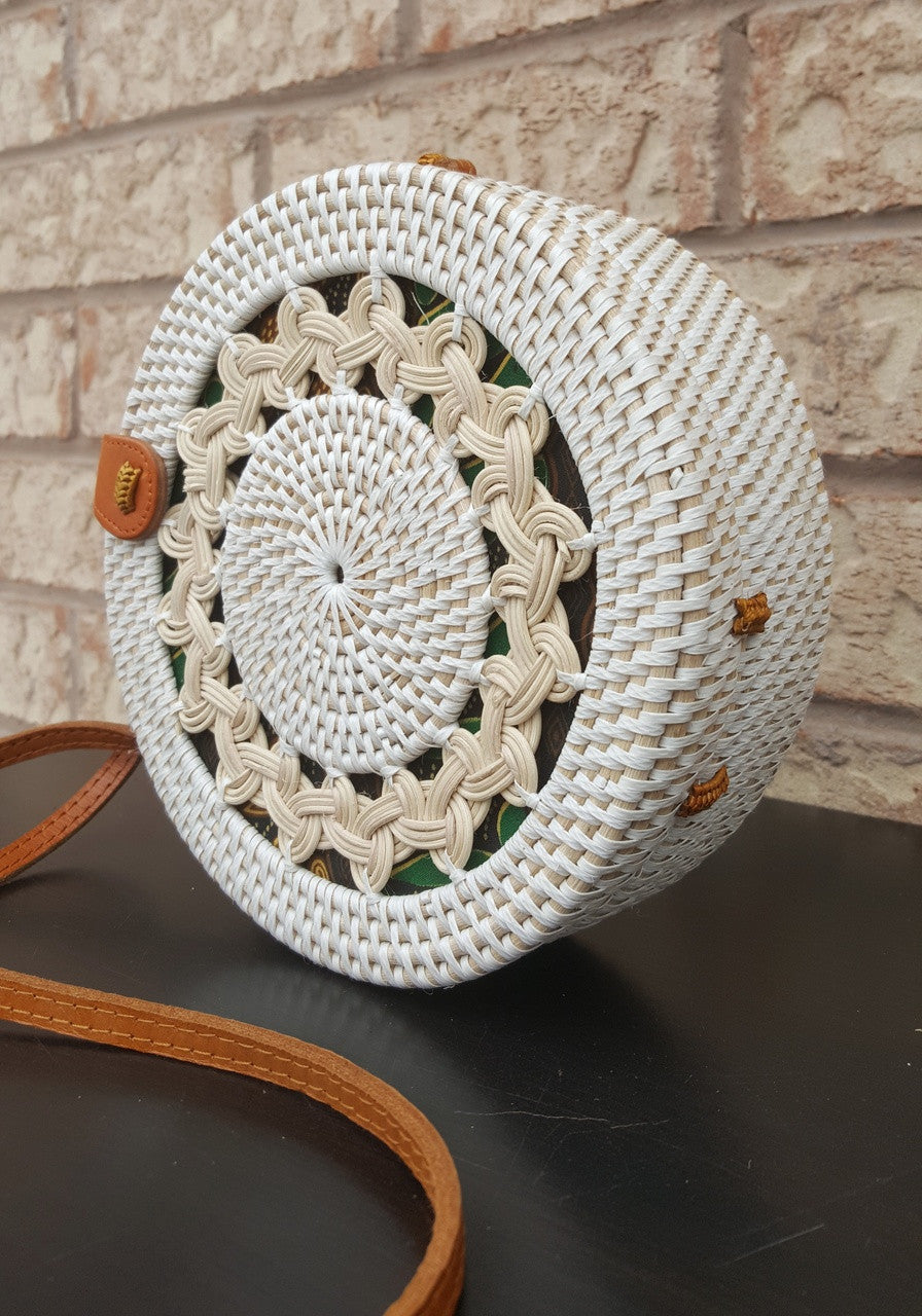 Round rattan bag Canada is handwoven and one of its kind with braids. 
