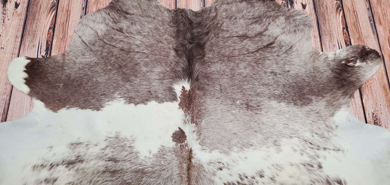 Treat your feet to the natural softness of authentic cowhide rugs. These brown and white rugs are perfect for adding a touch of texture and coziness to any room.