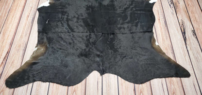 A unique and natural black cowhide rug is the perfect addition to any interior, it also add texture, style and a touch of rustic charm to any room. 
