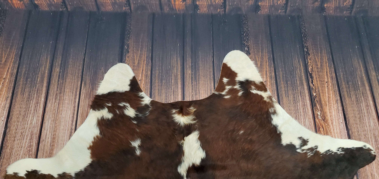 Bring a touch of the Southwest to your boutique with a genuine Hereford cowhide rug! Our handcrafted rugs are perfect for adding rustic appeal and high-quality style. 