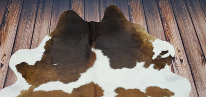 Make a bold statement in your home with this beautiful cowhide rug, featuring a unique mix of black, brown and white. This high-quality rug comes with free shipping across Canada.