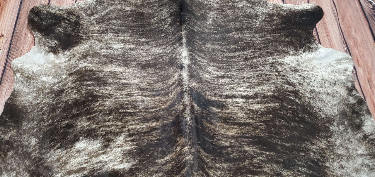Experience the warmth and luxury of an oversized cowhide rug in Canada. Shop our range of authentic cowhide rugs for a timeless addition to your home.