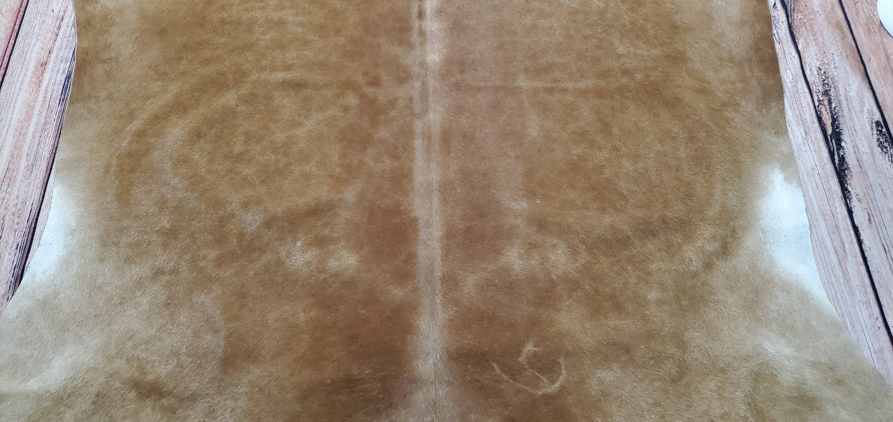 This cowhide rug will be a perfect addition to any mudroom.