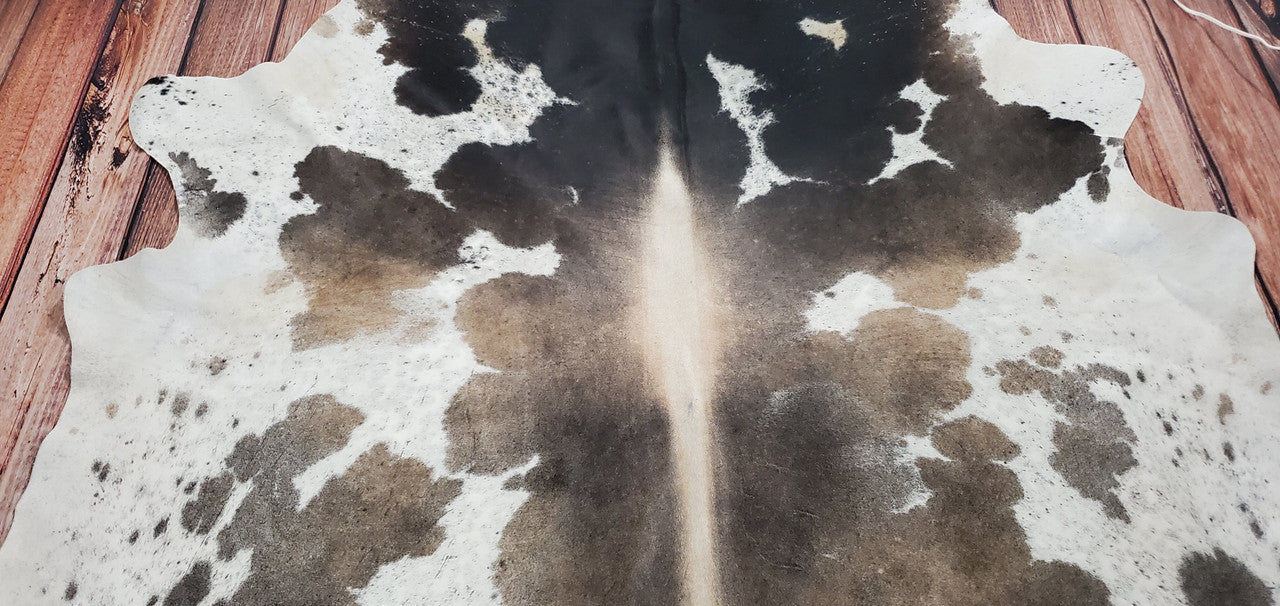 Looking for a sophisticated touch to your space? Our grey tricolor cowhide rug collection offers timeless elegance and natural charm for any home.