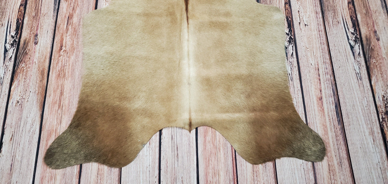 A cowhide rug can add a touch of luxury to any room. They are soft and smooth, with a real and natural feel. The shade is tan beige, making it a perfect addition to any space. A cowhide rug is a great addition to any home office.