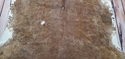 Add a touch of luxury to your home with this beautiful, high-quality brown cowhide rug!