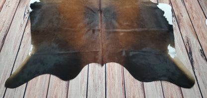 Welcome guests into your home with this stunning Brazilian cowhide rug in tricolor!