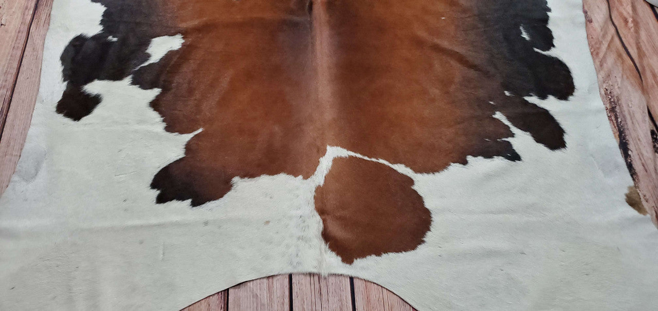 One of a kind dark brown and white cowhide rug free shipping all over Canada.