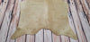 beige cowhide rug