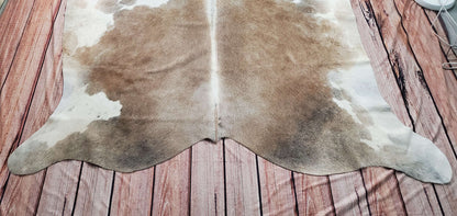 This dark cowhide rug is perfect for my home office! Its color and size are stunning, mostly dark brown, black and white, and it completely completes my home. 
