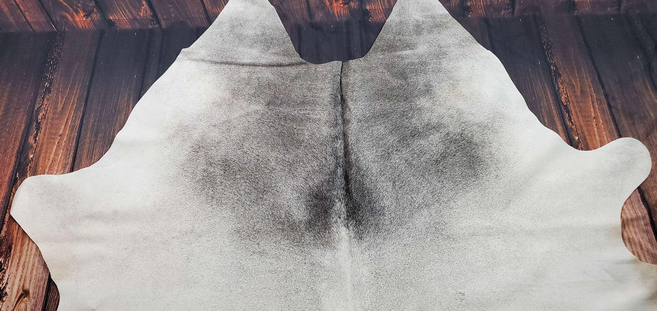 Real cowhide rug in one of its kind pattern, these cow hide area rugs are also great for upholstery, we have over hundreds of skin rugs in gray and white shades.