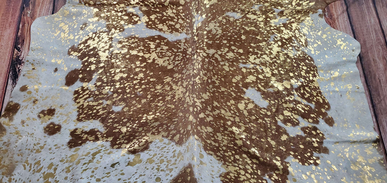 Metallic cowhide rugs are appealing in any room, stunning in gold against brown.
