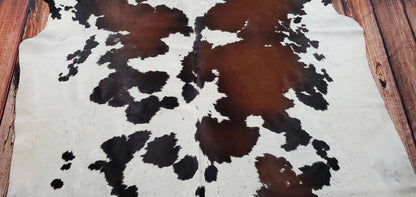 The extra large dark brown cowhide rug is beautiful and It looks great on wooden floor, will be the subject to glare in any room
