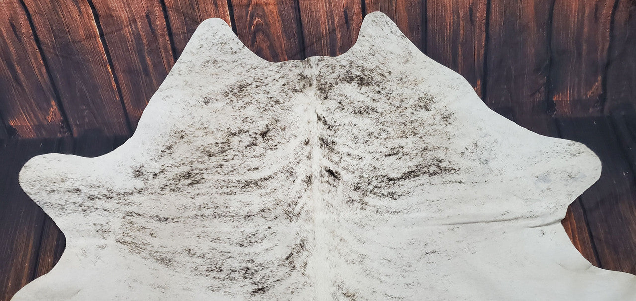 A grey brindle cowhide rug is a natural and real way to add some exotic flair to your living room.