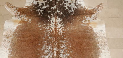 Not only does this cowhide rug add texture and color to the room, it also provides an element of sophistication that will make all who see it feel welcome. 
