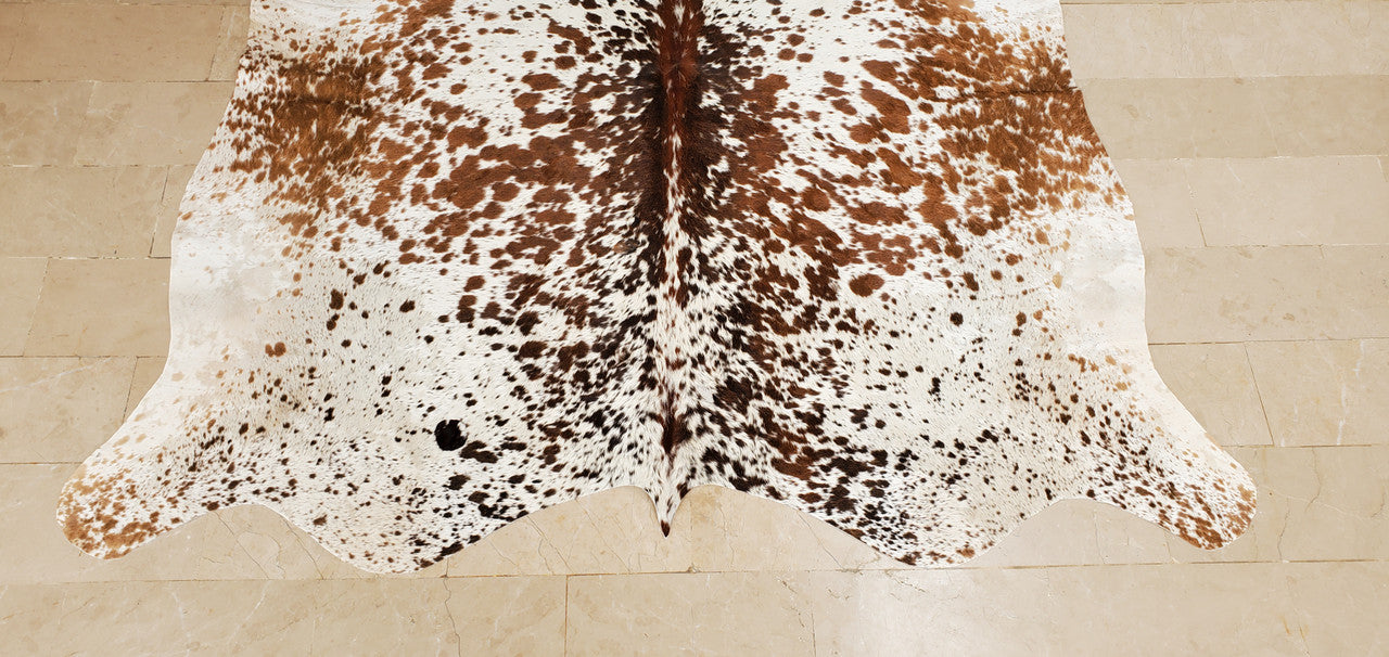 An extra small cowhide rug adds sophistication to the living room or home office, easy to pair with almost any other jute rug, best cowhides in Canada