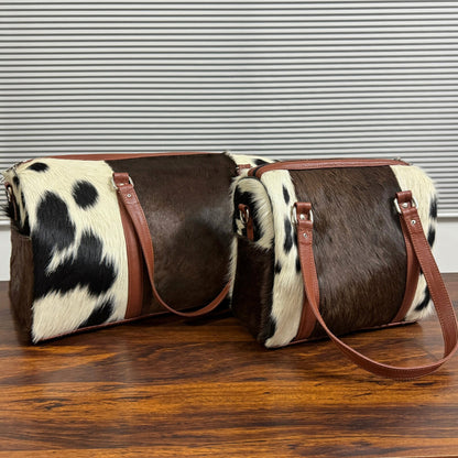 Set Of Cowhide Duffle Bags