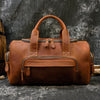 Crazy horse leather duffel designed for weekend trips with strong handles and carry-on size