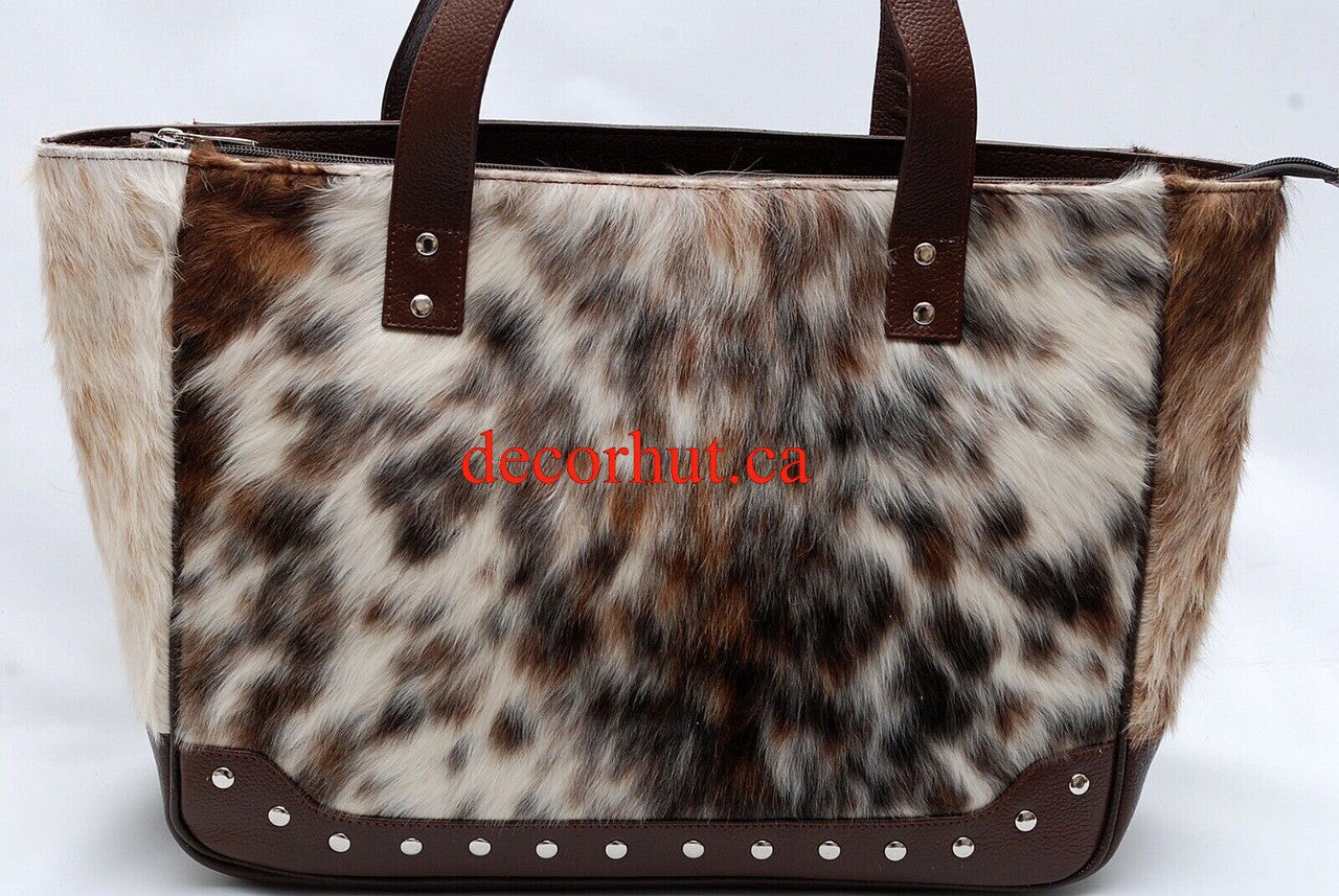 This stylish cowhide bag has a unique combination of brown and white color tones, perfect for making a statement. Get yours today and make an impression!