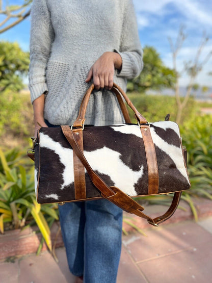 Stylish cowhide duffle bag, perfect for gym and everyday use.