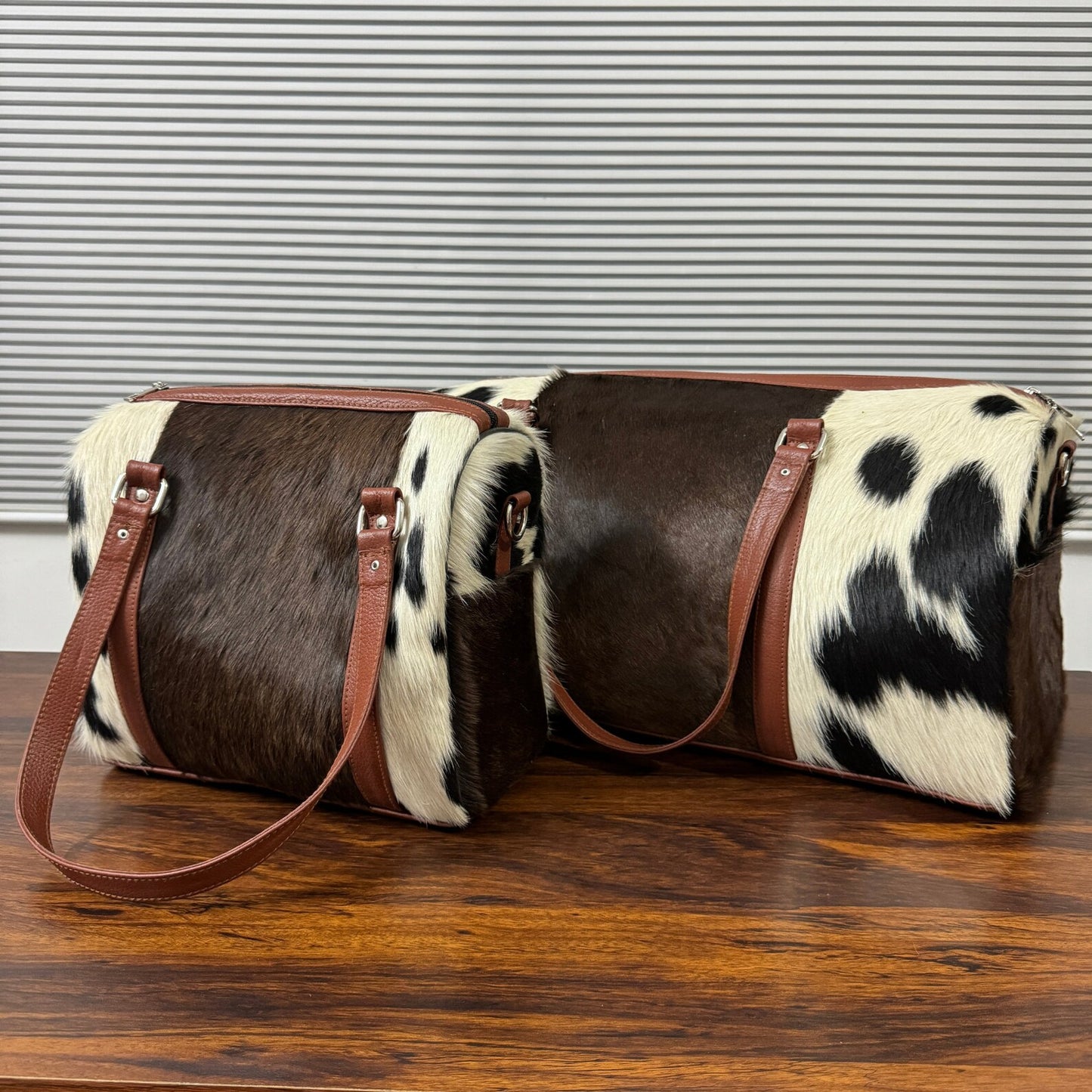 Set Of Cowhide Duffle Bags