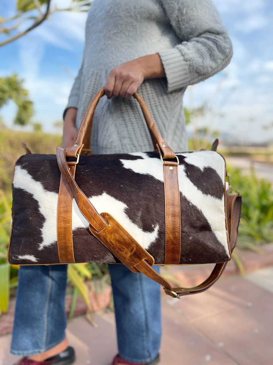 Elegant cowhide travel bag ideal for long-distance travel.