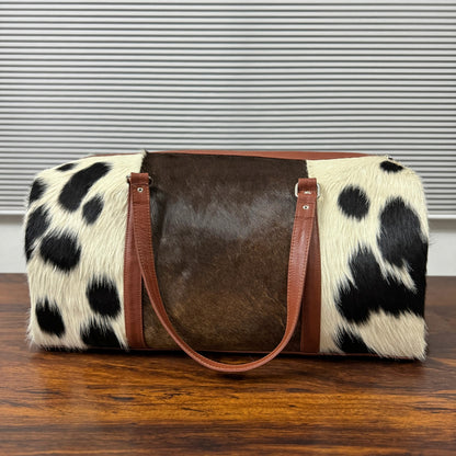 Set Of Cowhide Duffle Bags