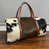 Set Of Cowhide Duffle Bags