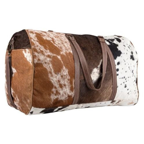 This cowhide bag spacious design allows you to store all your essentials while on the go. Whether it's for work or leisure, the perfect bag is always within reach.
