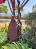 Cowhide sling bag with adjustable leather shoulder strap