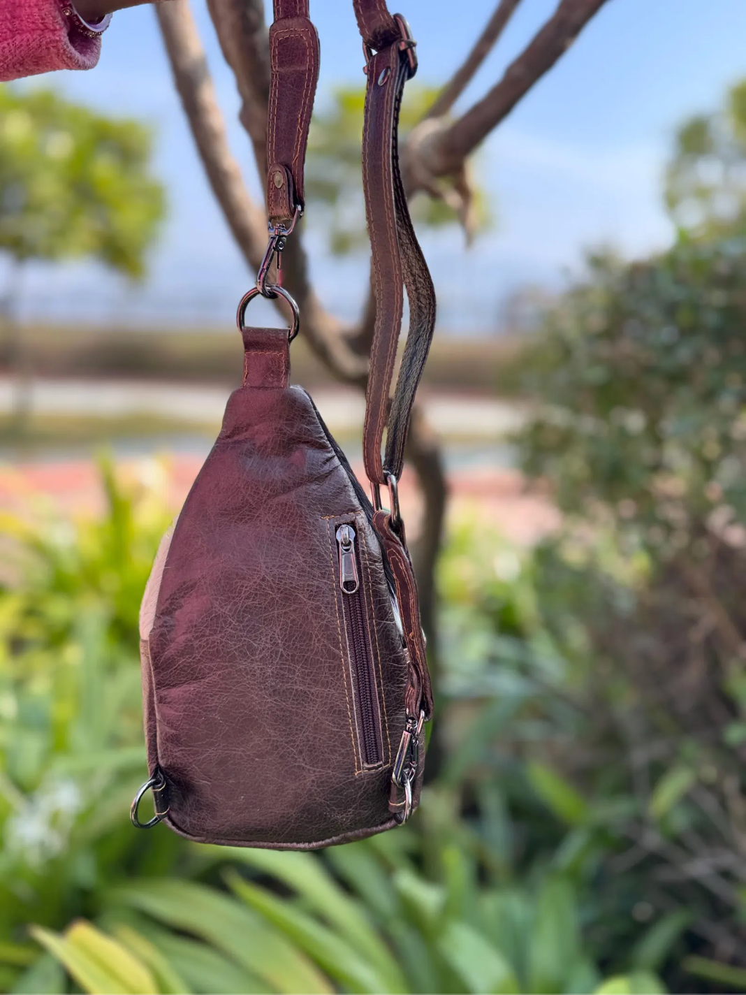 Cowhide sling bag with adjustable leather shoulder strap