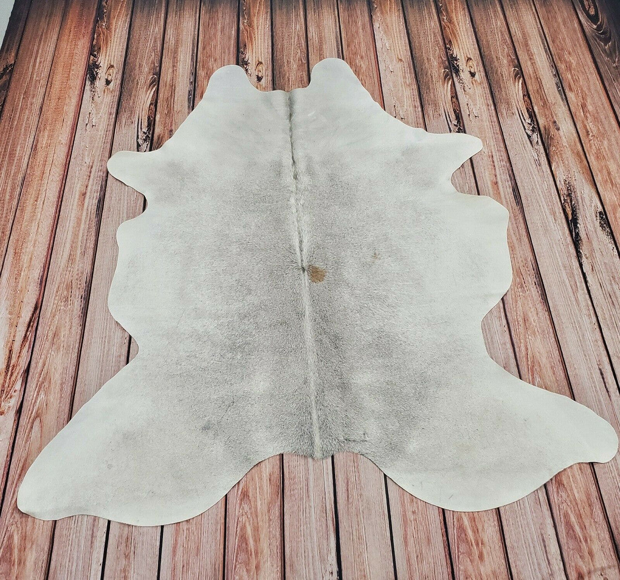 Now days office with a cowhide rug is a great idea, you can layer it or put it under the meeting table, these cowhides are stain resistant. 