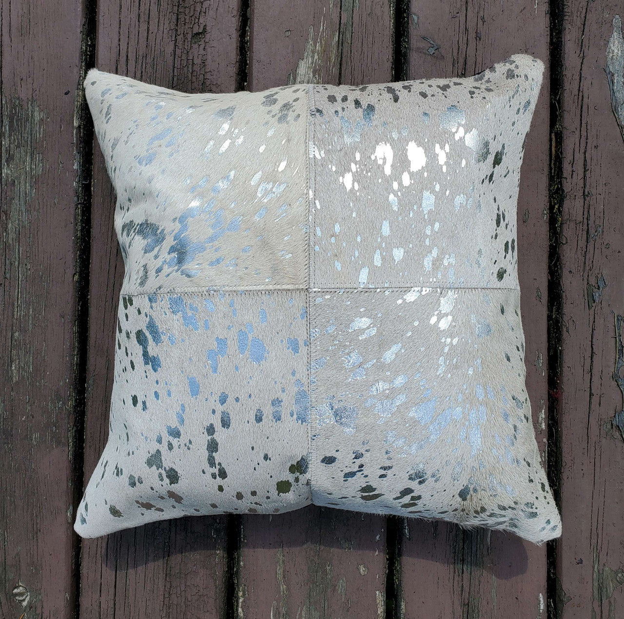 You will be obsessed with these cowhide pillow covers, which come in stunning silver metallic and very soft and smooth to touch. 
