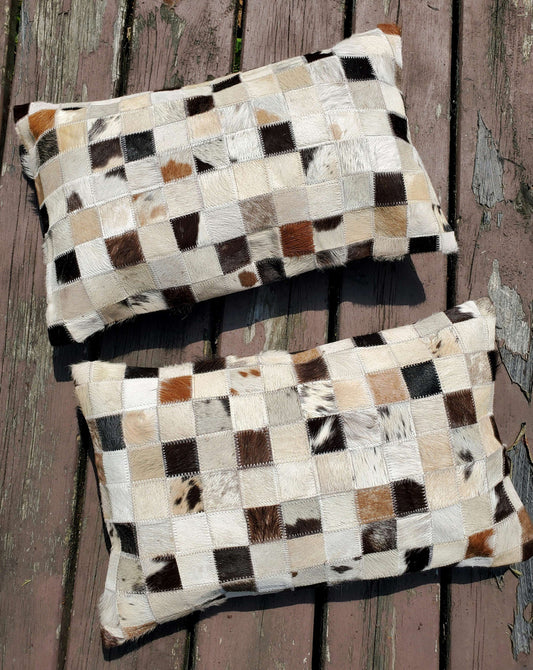 Fantastic cowhide pillow in lumbar style to work with, the thread and natural patchwork fabric is a wonderful spice to the decor. 