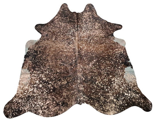 A stunning extra large metallic cowhide rug on a natural brown hide that will add visual interest and contrast to your interior. 
