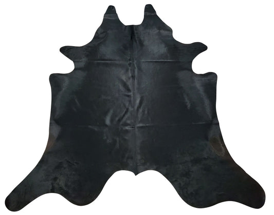 A stunning Brazilian solid black cowhide rug with exotic details and on point softness, the rug is more beautiful in person, you won't be disappointed.