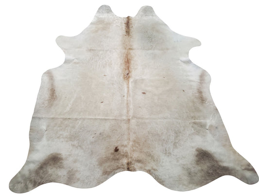 A stunning champagne ivory cowhide rug, feels soft and deep colors perfect for any room, it will be the most beautiful hair on hide you ever purchase. 