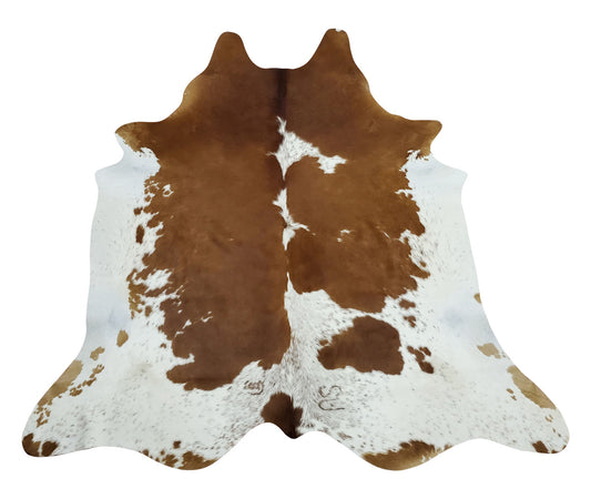 A beautiful cowhide rug in light and brown will carry your space like a charm, this cowhide rug will match you pillows, cushion and even coffee table.
