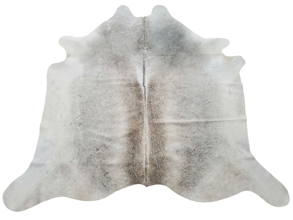 The soft sheen and exotic grey cowhide rug touches a perfect spot of rustic and modern touch