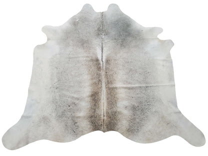 The soft sheen and exotic grey cowhide rug touches a perfect spot of rustic and modern touch