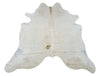 New small cream cowhide rug handpicked for the neutral pattern it will make living area charming