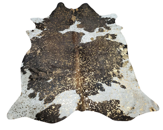 Metallic cowhide rugs go hand in hand with large sofa for cozying where you spend most of your evening, perfect shade, traditional and natural touch. 
