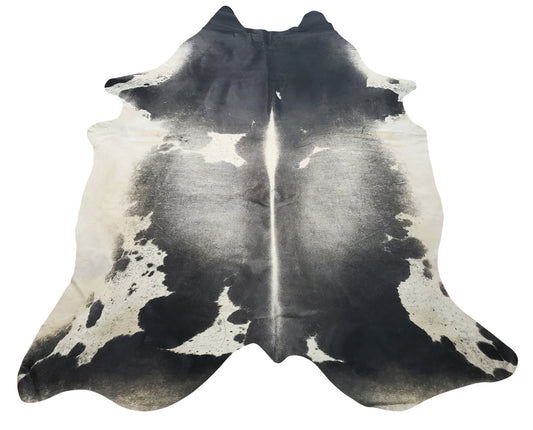 A new addition to our dark cowhide rug mostly grey with some black and white edges, a real cow hide is always unique and great for any space layering.