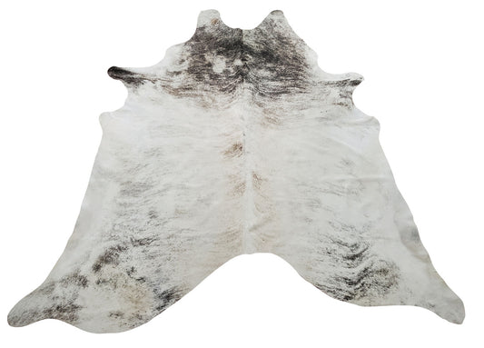 Extra large cowhide rug will bring unique texture to living space, the exotic mix of cream brindle perfectly blends in to sofa and fireplace. 