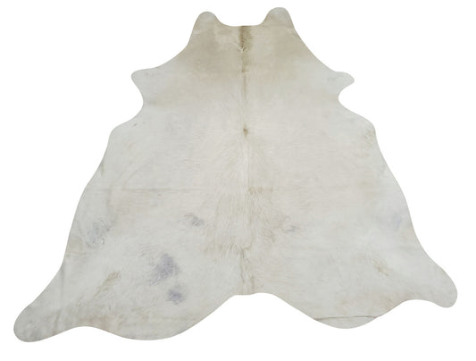 This natural light cowhide rug is mostly white with some grey undertone and with a real brand markings. 